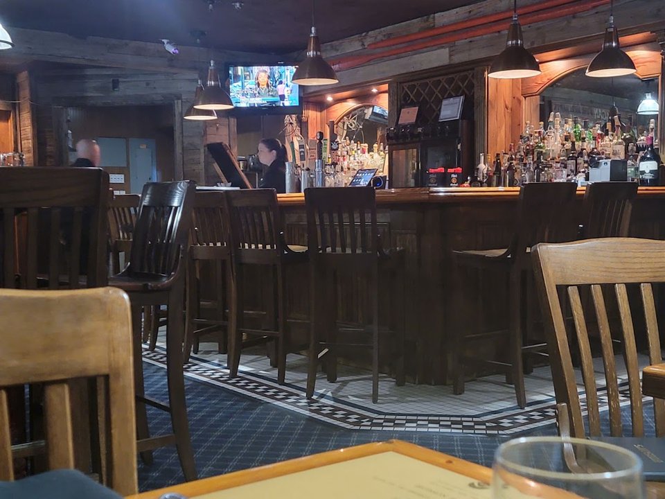 Roadside seafood restaurant interior with simple seating.
